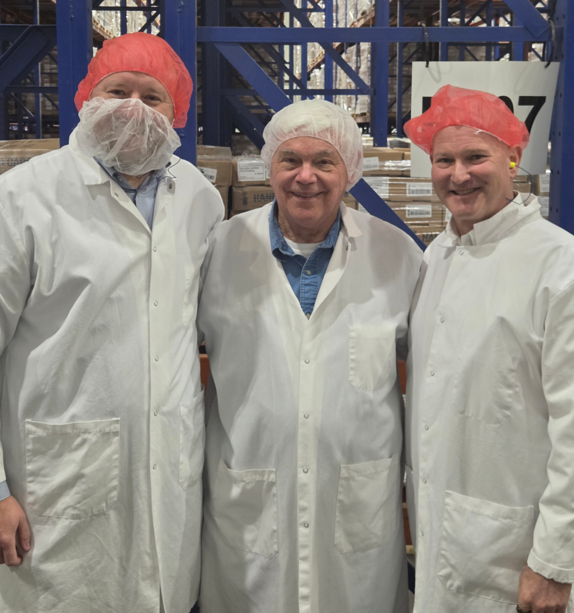 3Roots' Chris Miller and Grady Vanderhoofven pose with Graham Hunter, founder of Custom Foods of America